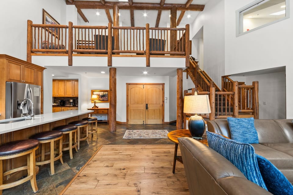 Relax in your stunning loft-style retreat with soaring ceilings, rustic wood beams, and an open layout perfect for gathering.