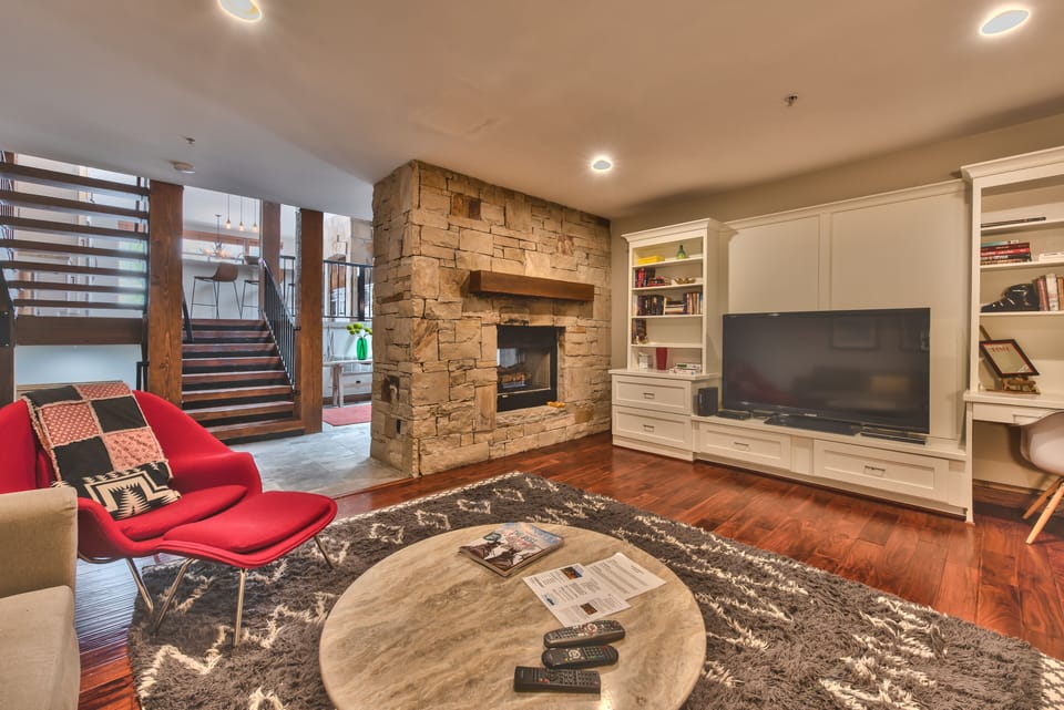 Entry Level Family Room/Media Room with 50" HD TV, DVD, See-through Fireplace, and Comfortable Seating, including a Queen Sofa Sleeper