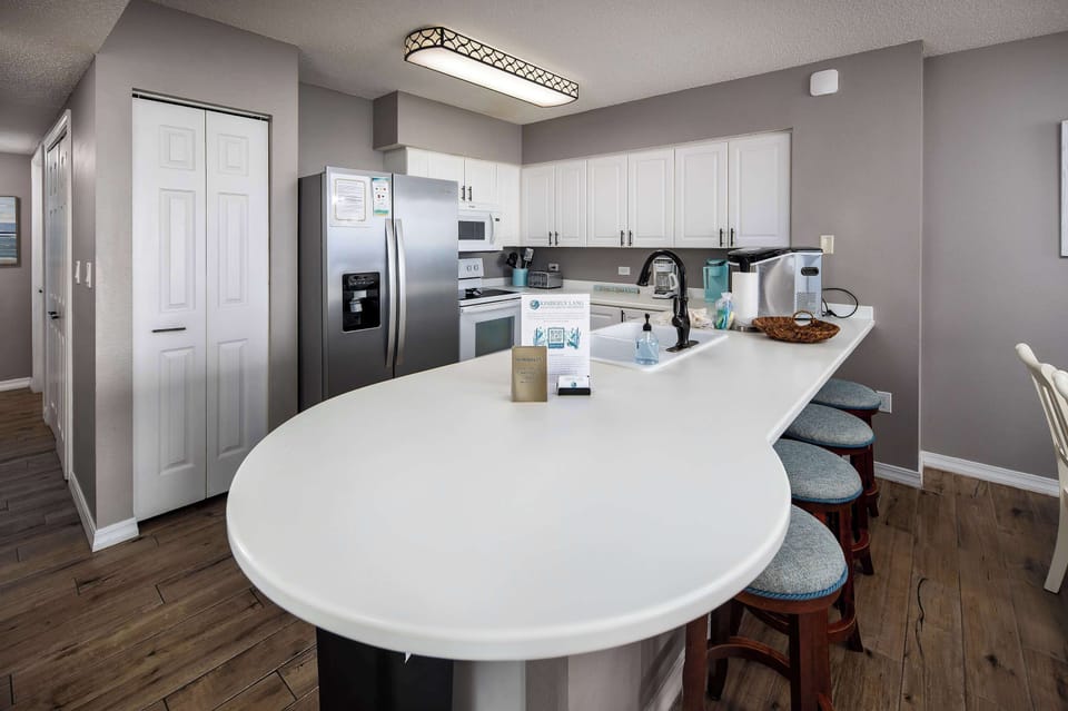Fully stocked kitchen with breakfast bar