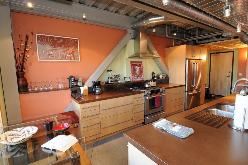 Custom concrete counter tops and high end appliances.