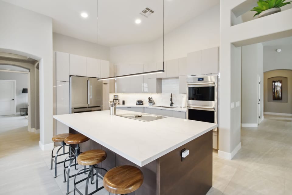 Oversized Kitchen Island with bar stools.