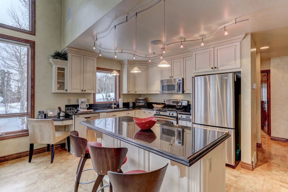 Gourmet Kitchen with Stainless Steel Appliances, Bar Seating for 3