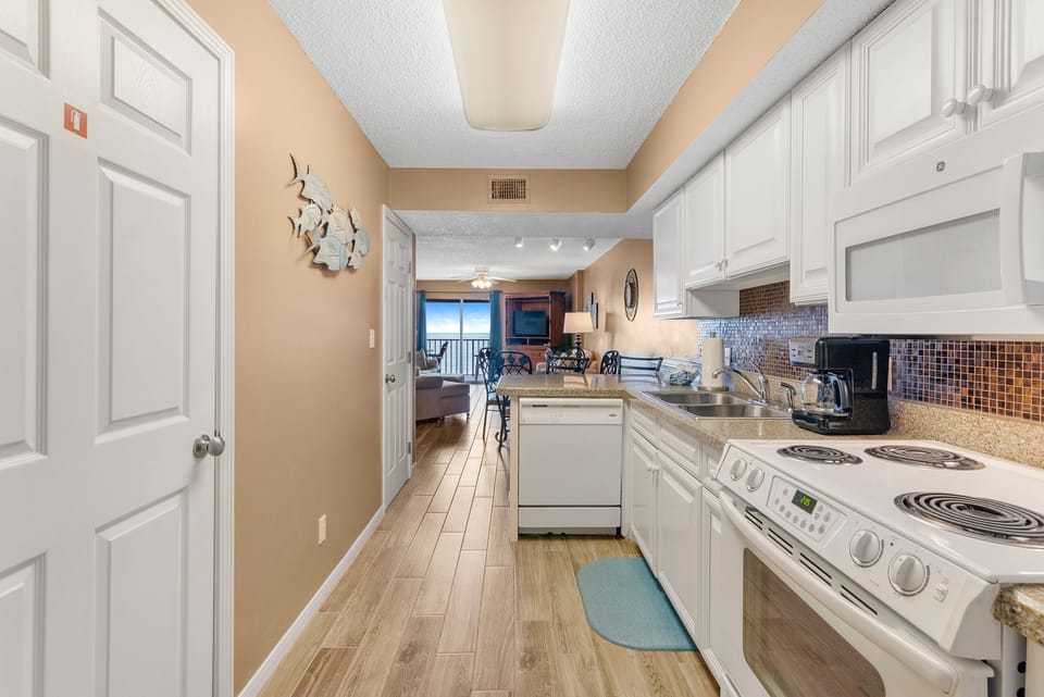 Unit 1805 - Unit 1805 is located in Building I of the Ocean House complex in Gulf Shores. Upon entry, you are in this fully stocked  kitchen.