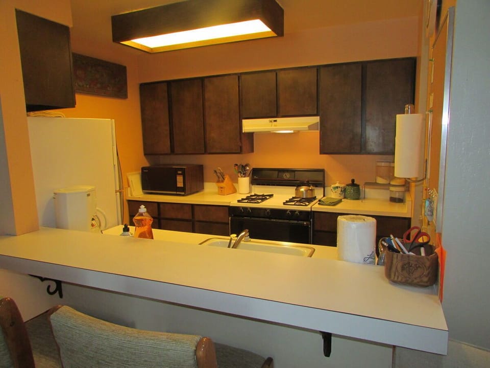opens to living room with breakfast bar