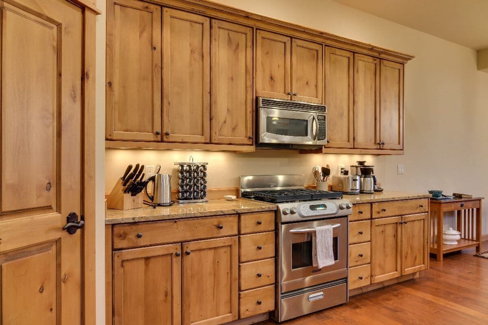 The kitchen has updated appliances with everything you will need including a walk in pantry.