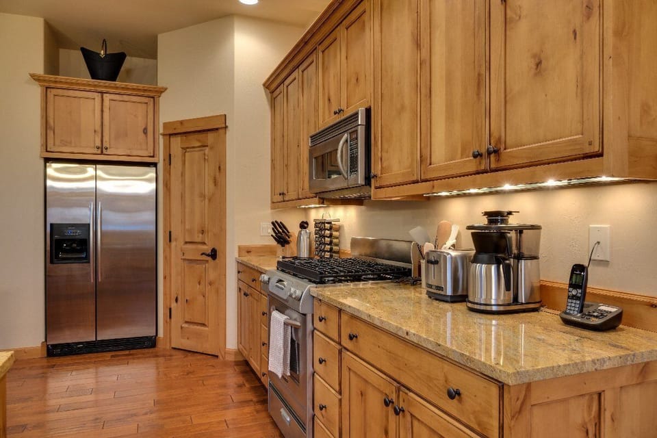 The kitchen has updated appliances with everything you will need including a walk in pantry.