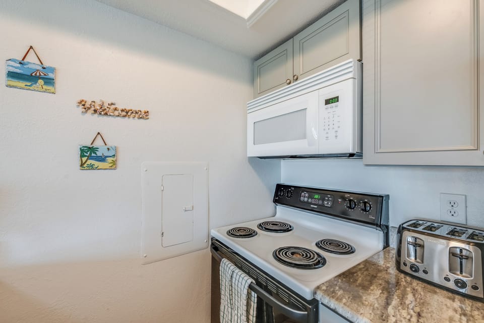 Your fully equipped kitchen features everything needed for home-cooked meals, from stove to microwave to toaster.