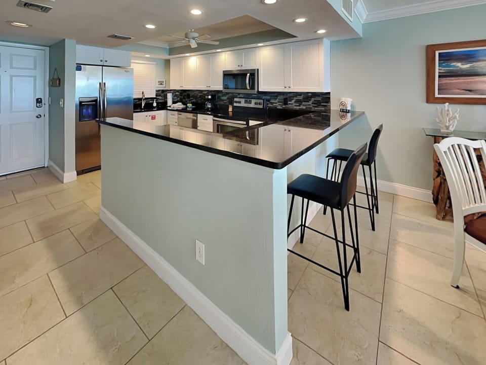 Fully Equipped Kitchen with Breakfast Bar Seating for Two