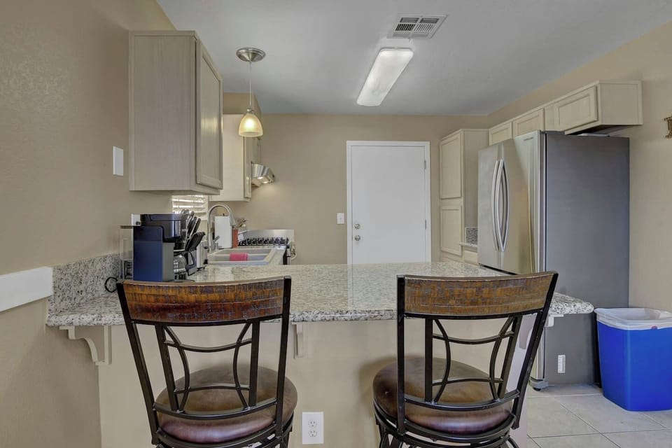 Full kitchen with modern appliances ideal for extended stays, remote workers, and corporate groups in Las Vegas.