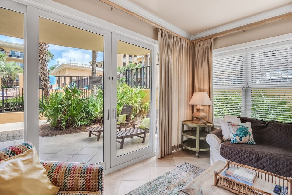 Loungers  and table on the patio - Loungers and a large outdoor dining table just outside the sliding glass doors of your G105 living room. Adagio G105 is the closest three-bedroom to the beach walkover - just steps from your patio!