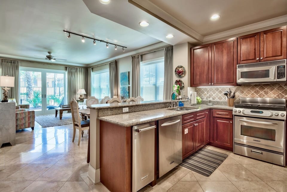 Custom Kitchen in Adagio G105 - Granite counter tops, garbage disposal, a wide array of cooking ware, glass ware, stand alone ice maker and a welcome gift from Your Friend at the Beach greet you when you arrive to Adagio G105!