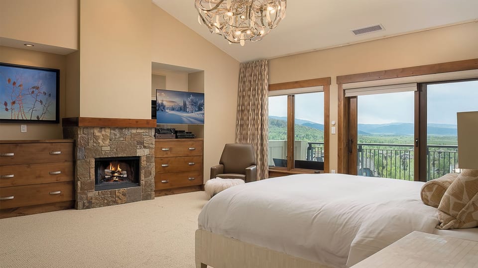 Bedroom 1, Main Level - Primary king bedroom with fireplace and TV