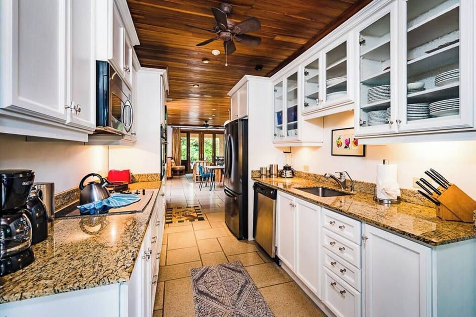 Enjoy the beautiful granite counters and all the needed equipment in this modern-style kitchen.