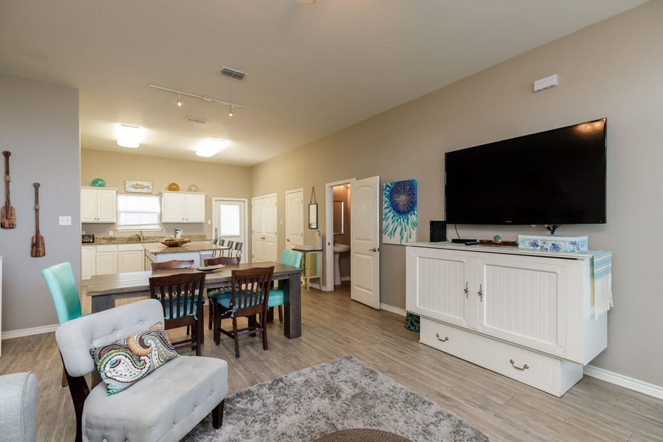 Step into your bright, open-concept haven where coastal charm meets modern comfort, perfect for relaxing evenings and memorable meals together.