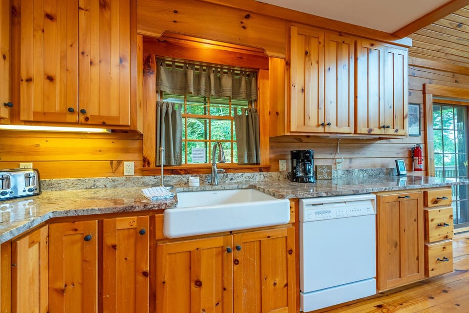 Kitchen with dishwasher and drip-style coffeemaker
