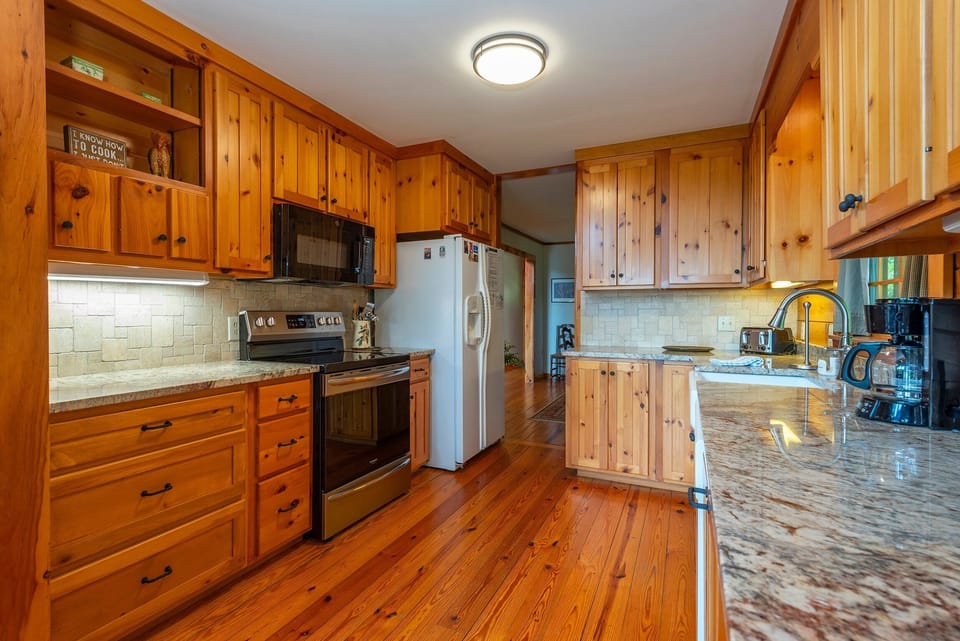 Kitchen with dishwasher and drip-style coffeemaker