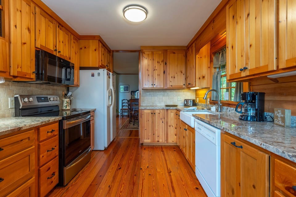 Kitchen with dishwasher and drip-style coffeemaker