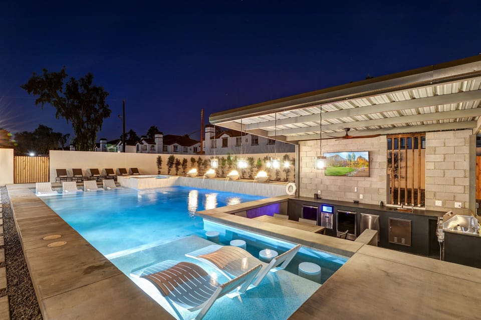 Sunken Bar has 2 fridges, ice maker, grill, 65" flat screen TV.