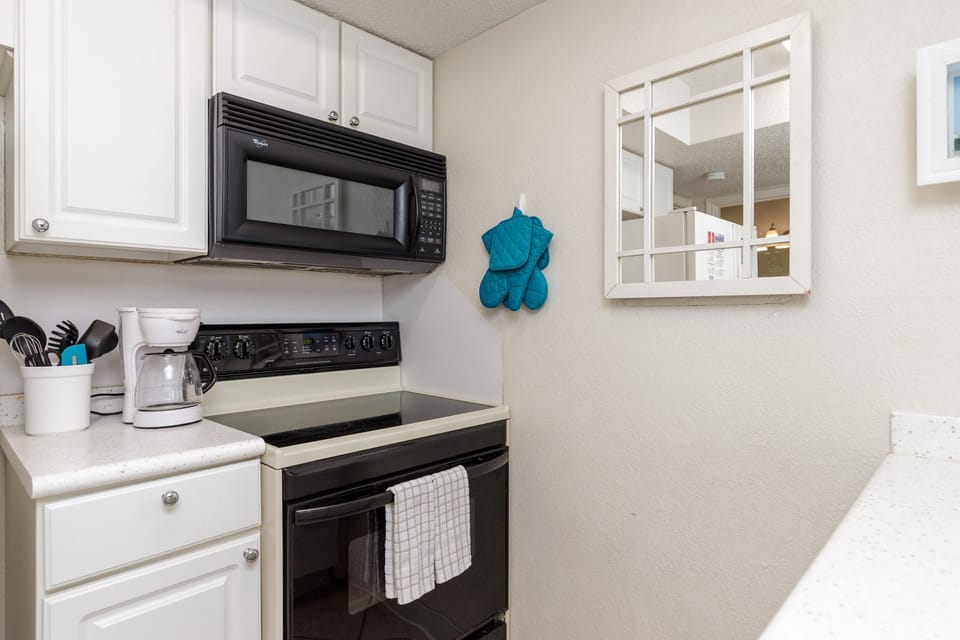 Your fully equipped kitchen features modern appliances and ample counter space for preparing delicious home-cooked meals during your stay.