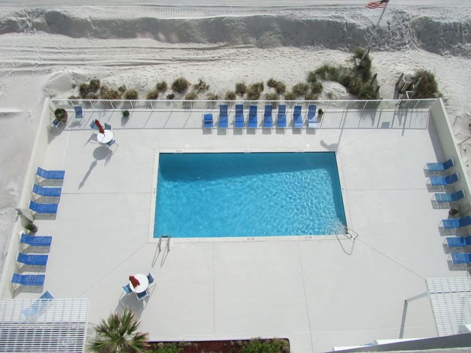 Outdoor Communal Pool - Gulf Tower offers an outdoor pool that provides lounge chairs and plenty of seating for each guest to enjoy
