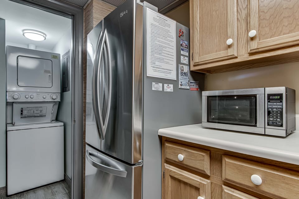 Kitchen - The kitchen boasts nice stainless appliances and for convenience, a stack washer/dryer is provided.