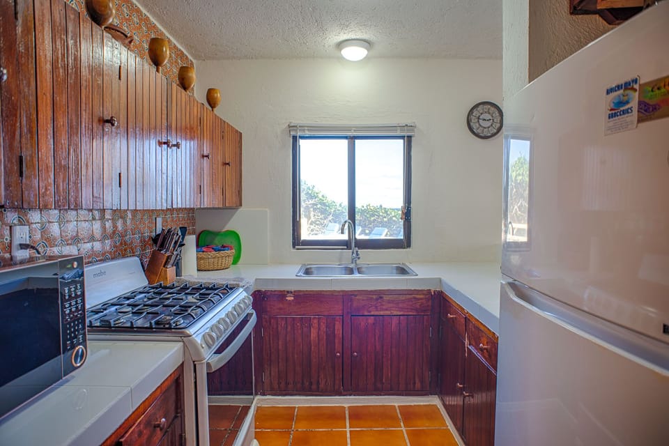 Kitchen with pool with pool and ocean views
