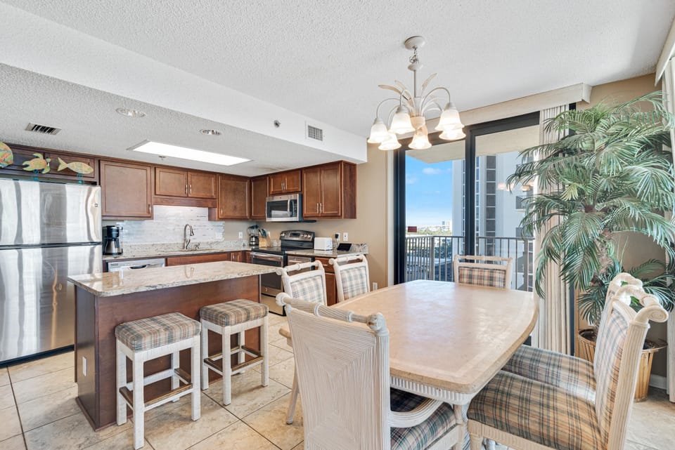 Spacious Living Area with plenty of comfortable seating and direct balcony access so you can enjoy views of the gulf from almost everywhere!