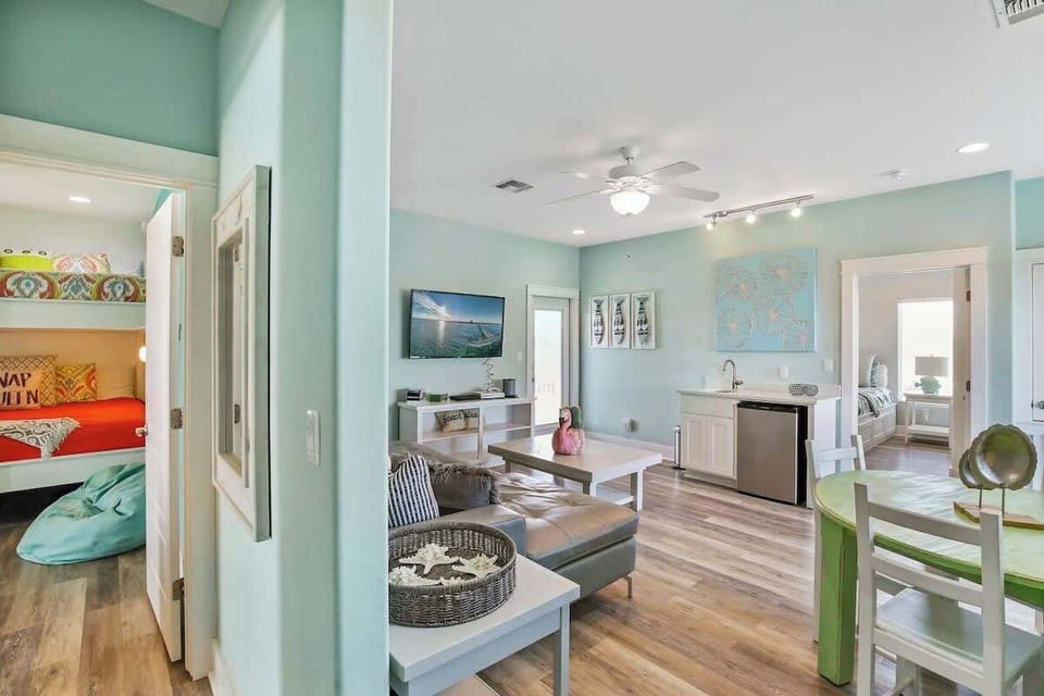 Upper Loft Wide — Bunk Room, Gray Sectional, Sand Dollar Art & Kitchenette