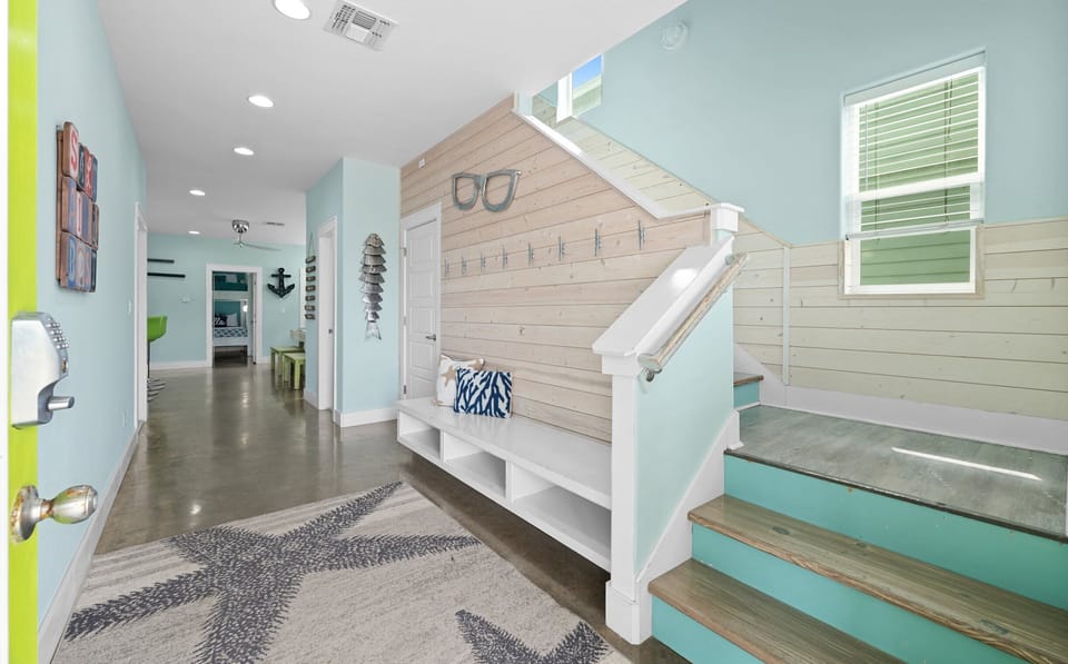 Entry — Lime Green Door, Teal Staircase, Shiplap Wall with Cleat Hooks & Starfish Rug