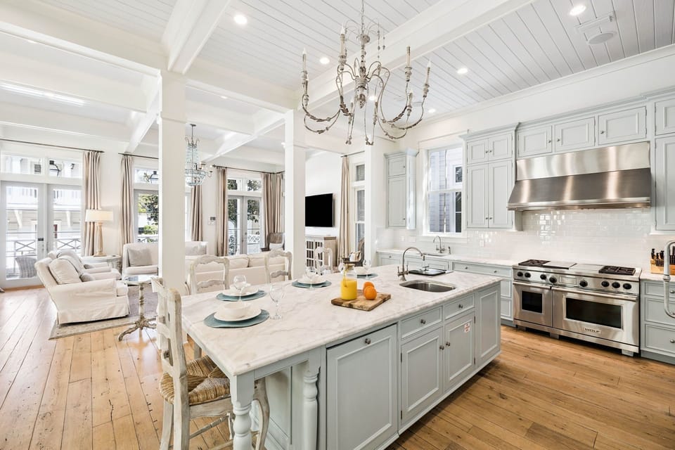 Your elegant kitchen features marble countertops, professional appliances, and flows seamlessly into the living space.