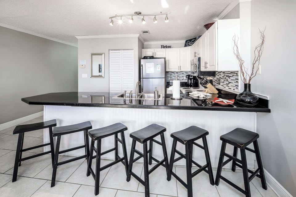 Fully stocked kitchen with breakfast bar