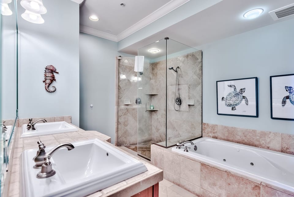Shower and jetted tub in master bathroom - Master bath has stand alone shower with two shower heads, one is a hand held shower. Large jetted tub, double sinks, hand soaps and shower soaps provided plus starter supplies of paper goods in every bathroom (two rolls of toilet paper per bathroom supplied).