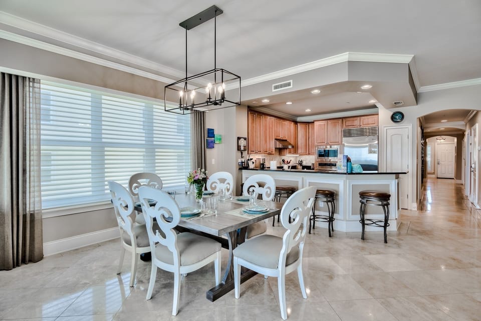 Dining area of A305 - Easy access to dining area from the kitchen - large table and barstools for additional seating.