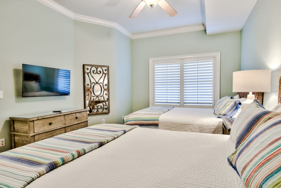 Fourth bedroom with TWO queen Beds - Large flat screen TV in bedroom with two comfortable queen beds.