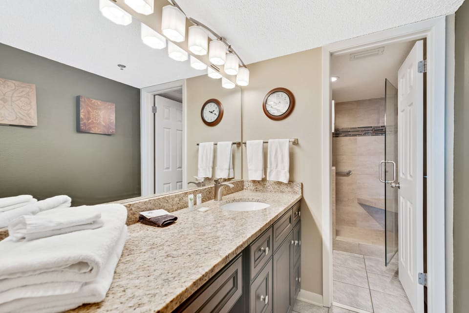 Private Master Bath with Granite Counter Top, Extended Vanity and beautifully Tiled Shower.