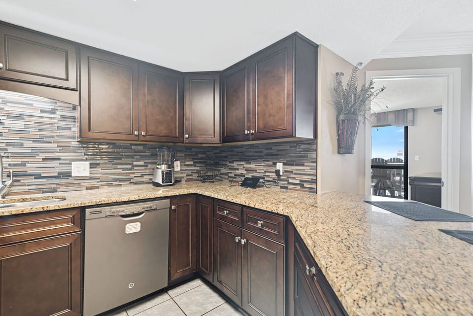 Spacious Living Area with plenty of comfortable seating and direct balcony access so you can enjoy views of the gulf from almost everywhere!