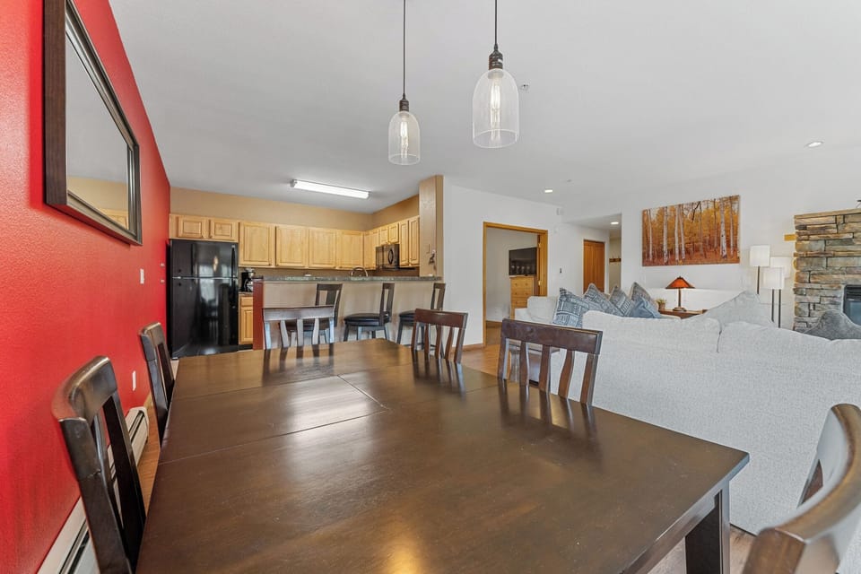Gather around your spacious dining table while the open kitchen lets you stay connected to loved ones relaxing in the bright living area.