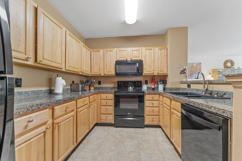Cook memorable meals in your fully-equipped kitchen featuring granite countertops, modern appliances, and abundant cabinet storage for all your culinary adventures.