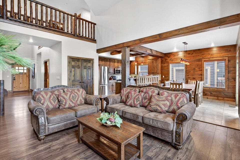 Living room with open concept design flowing into the kitchen and dining room