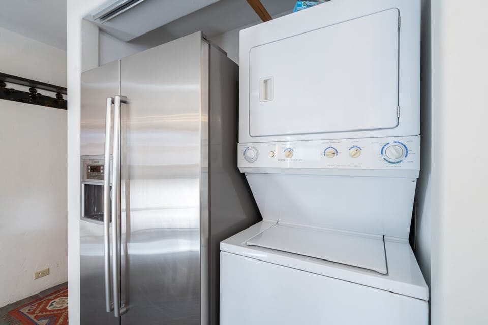 Refrigerator and Laundry Center in the Kitchen.