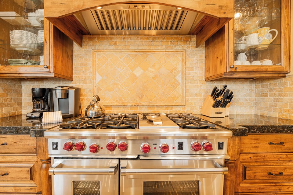 Double door oven with 6-burner gas range.