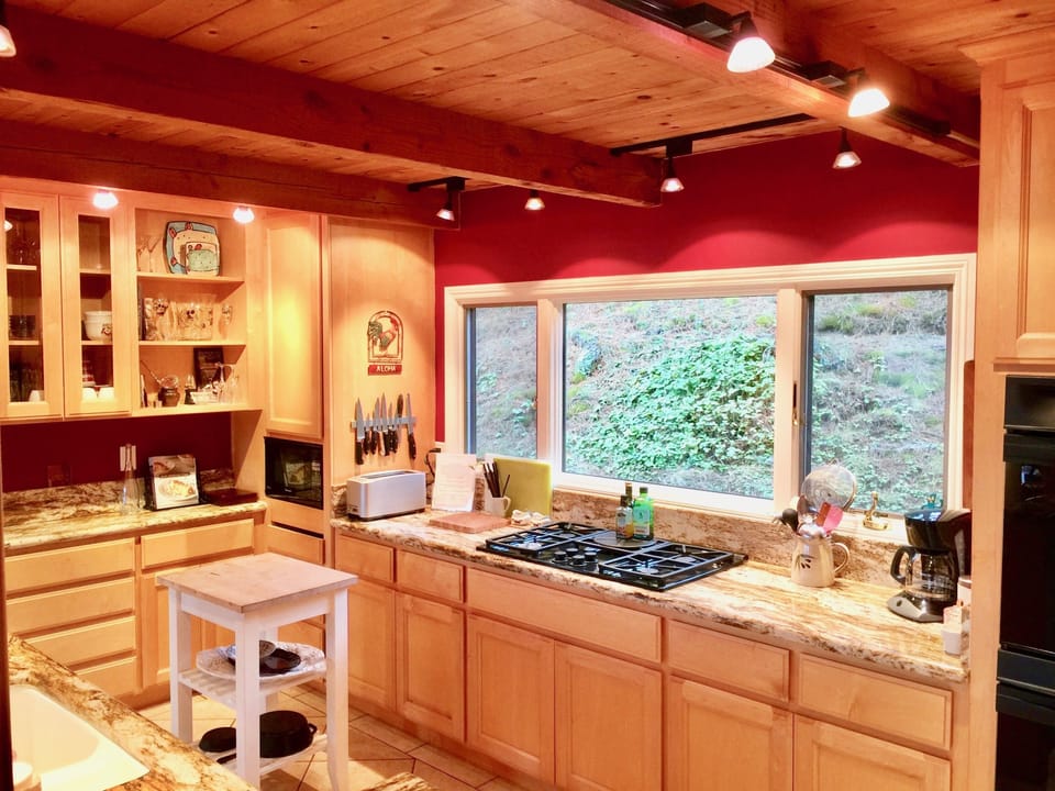 High End Kitchen with Brazilian Marble Counter Tops and Custom Made Cabinets.