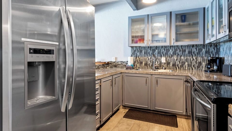 Fully equipped kitchen with stainless steel appliances