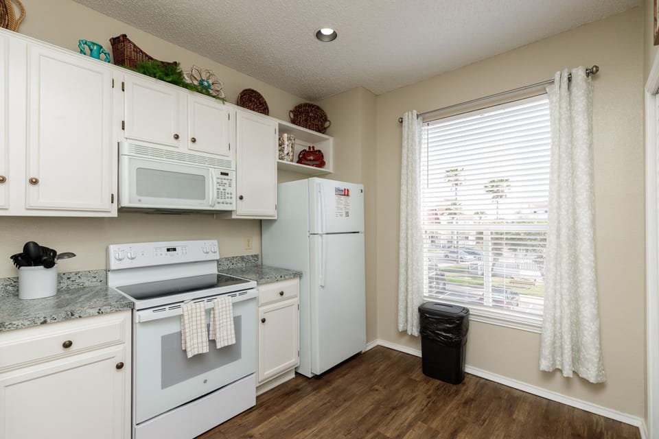 Step into your fully equipped kitchen with modern appliances and plenty of storage—perfect for cooking meals and staying comfortable during your stay.