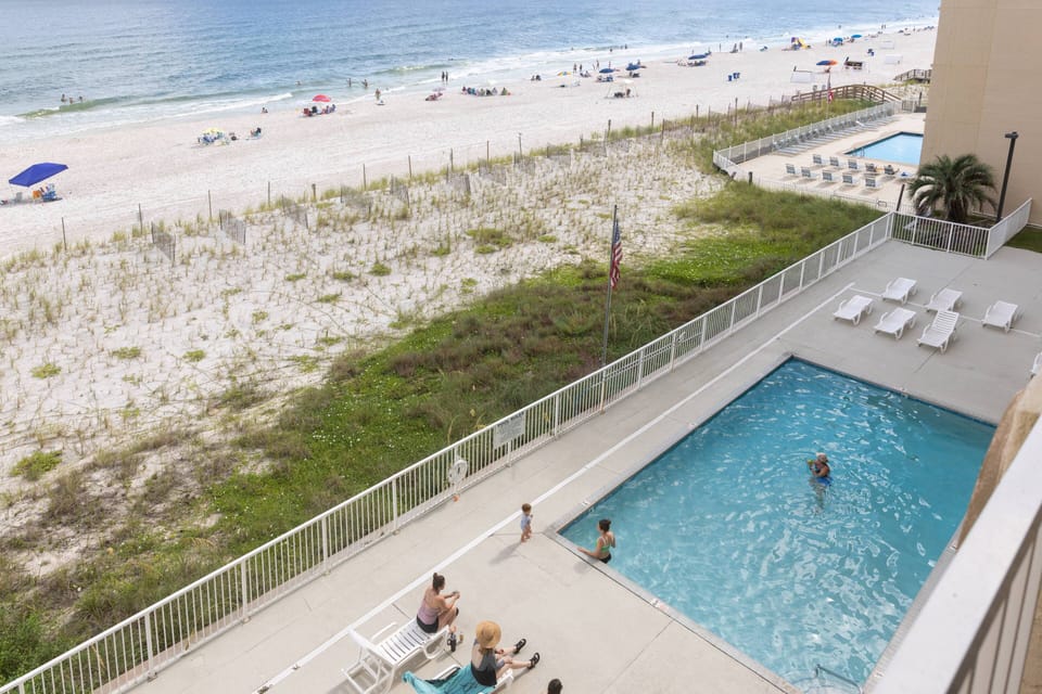 Pool - Tropical Winds complex offers a beach front, outdoor pool for guests to enjoy. Seating and loungers are provided for spending time relaxing in the sun.