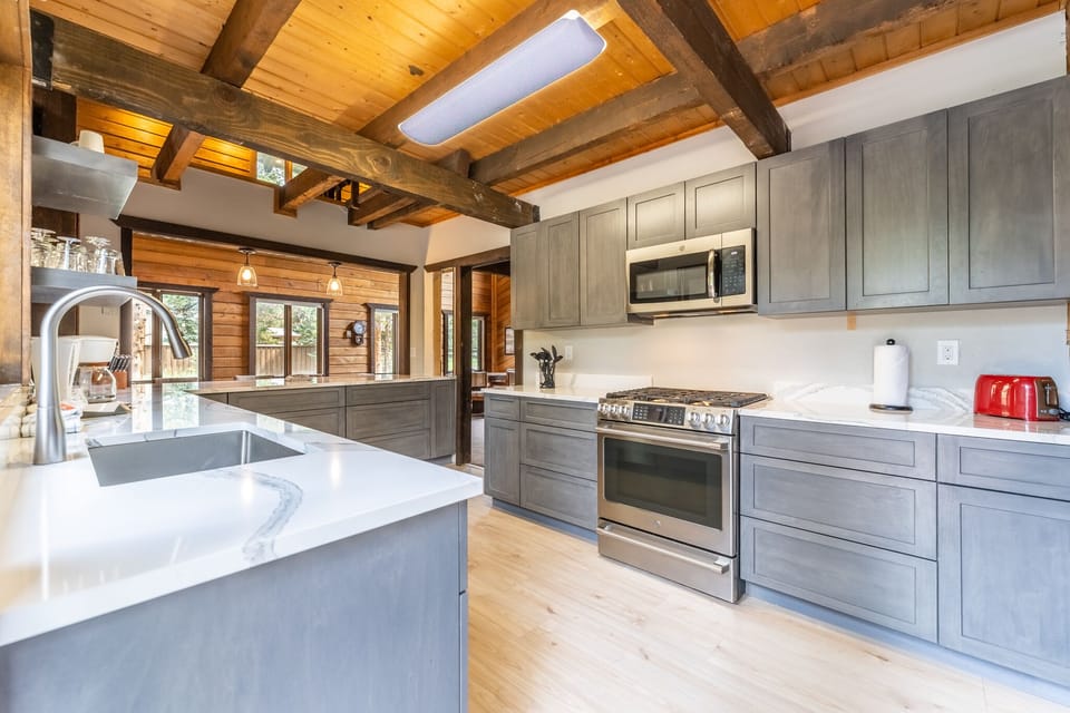 Updated full size kitchen with granite countertops, hardwood flooring and new stainless steel appliances throughout.