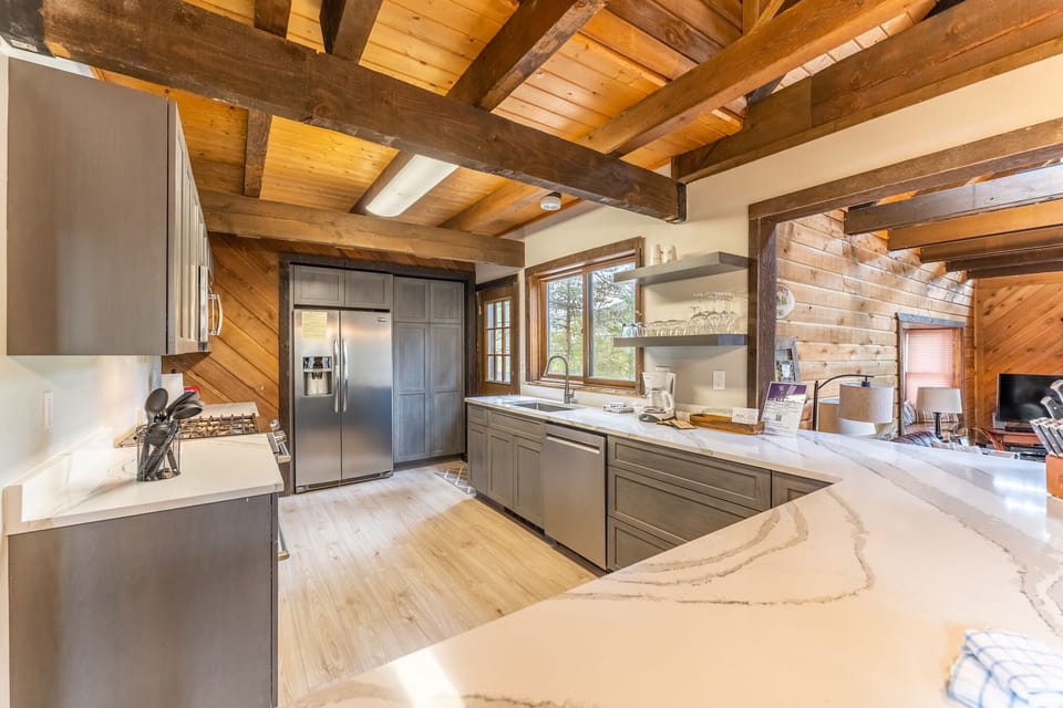 Updated full size kitchen with granite countertops, hardwood flooring and new stainless steel appliances throughout.