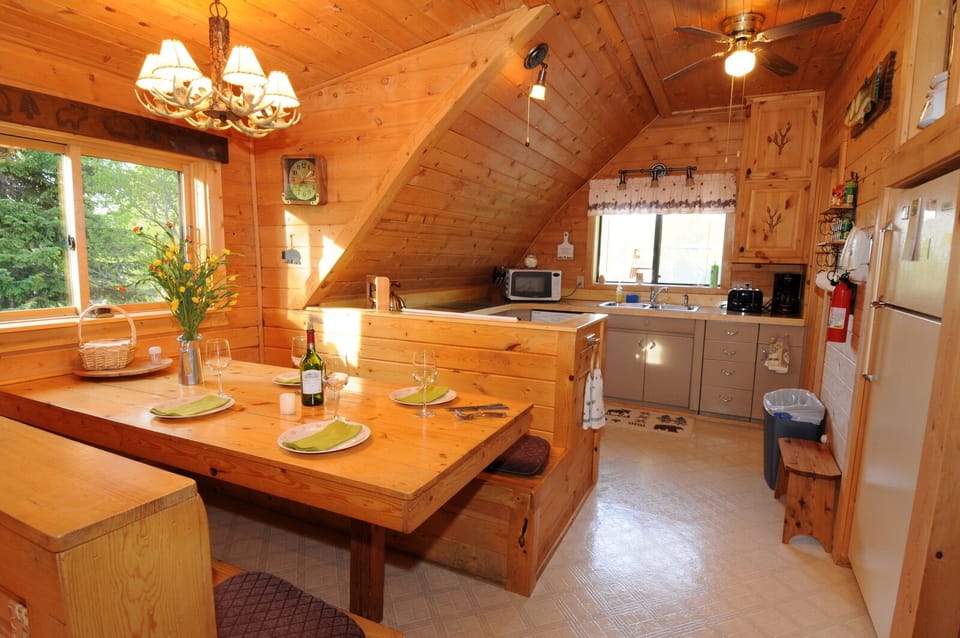 There is ample space for a crowd of snowmobilers or hikers in this bright and cheerful home.