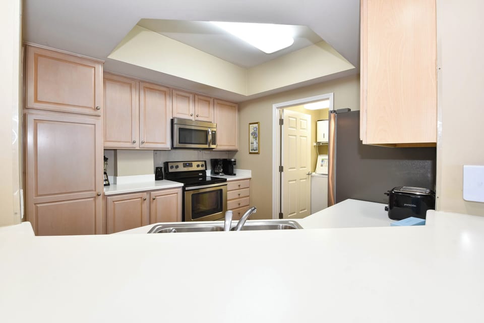 Silver Beach Towers East 1502 - Kitchen from Breakfast Bar