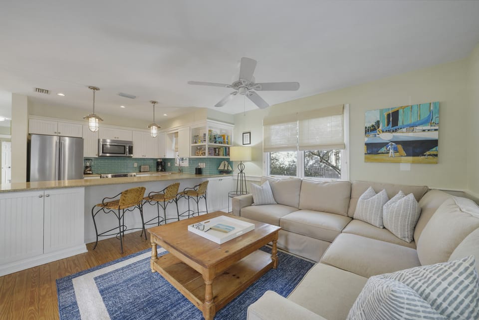 ADJACENT LIVING OFF KITCHEN W/LARGE SECTIONAL